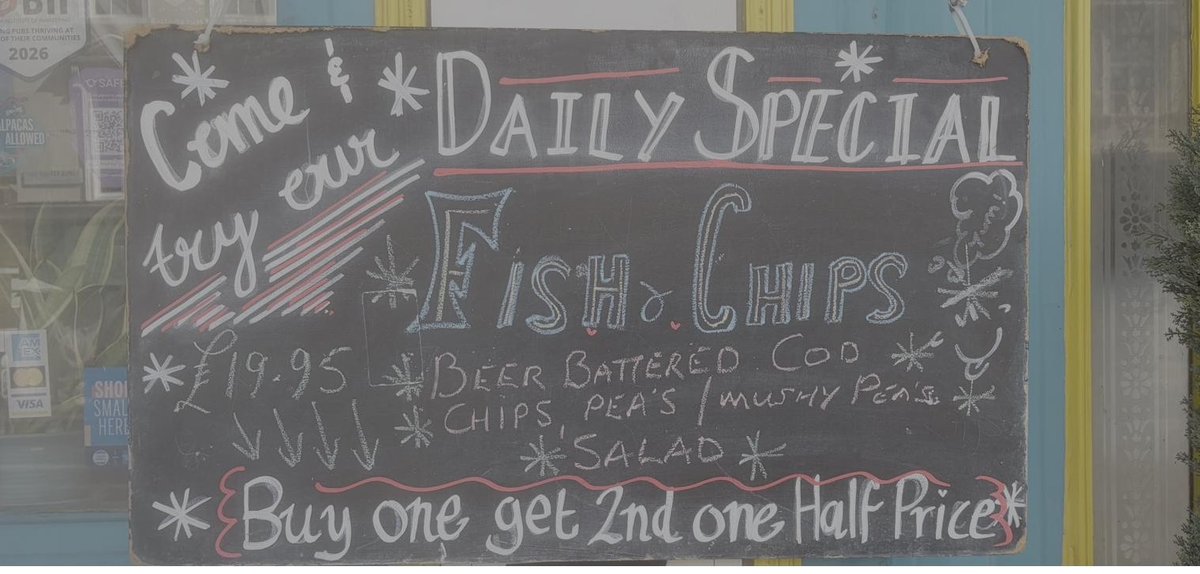 Daily special chalkboard: beer battered cod fish and chips, £19.95, buy one get 2nd one half price