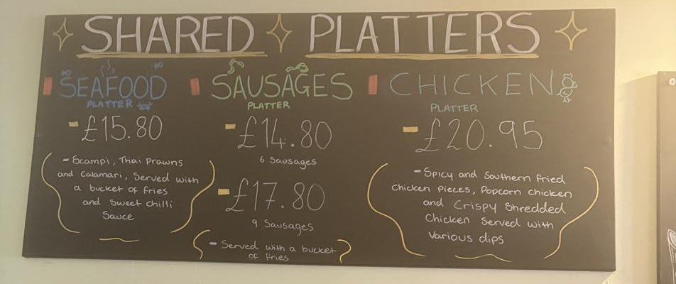 Shared platters chalkboard: seafood, sausages and chicken platters